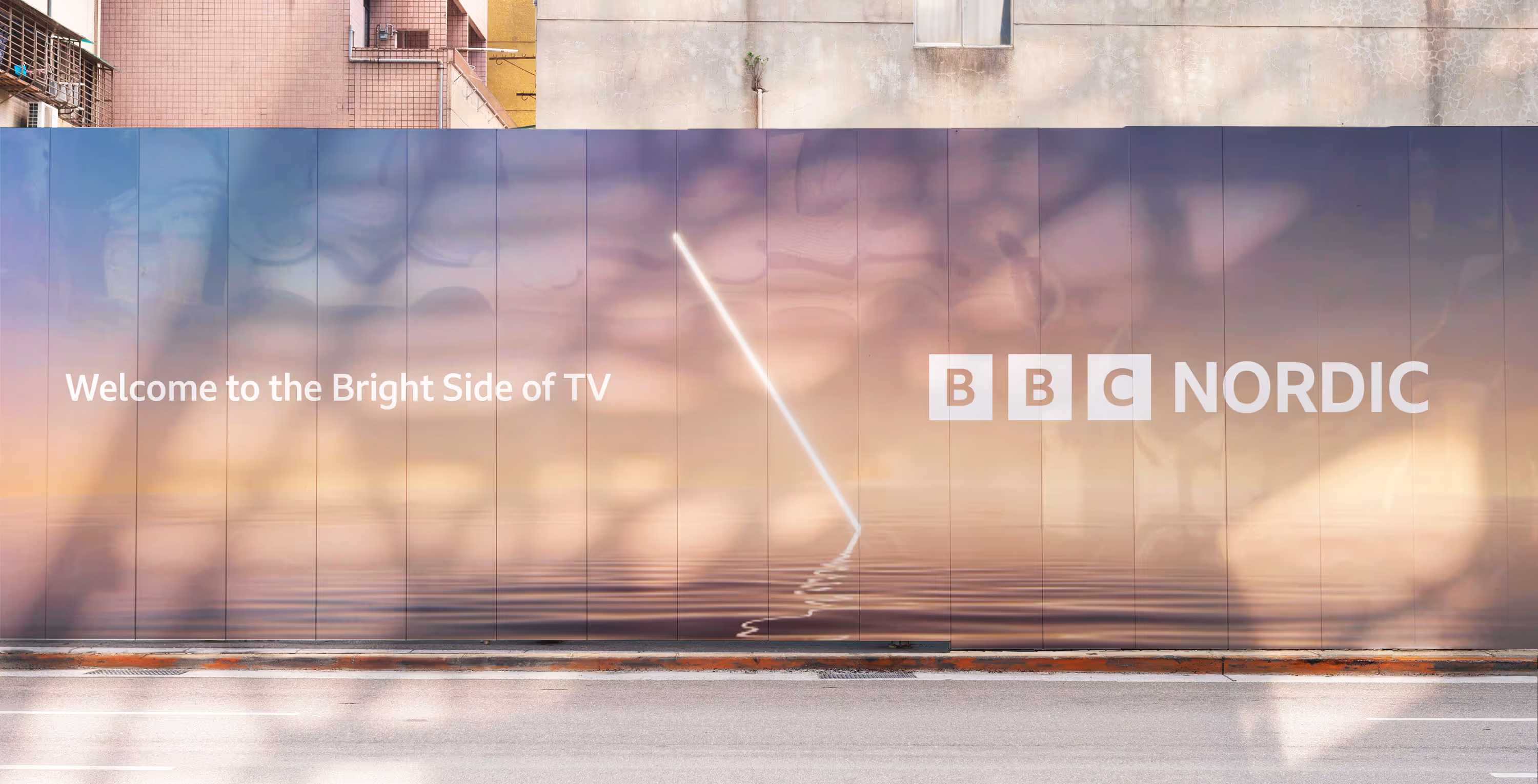 A billboard with slogan 'Welcome to the Bright Side of TV' featuring the BBC Nordic branding system