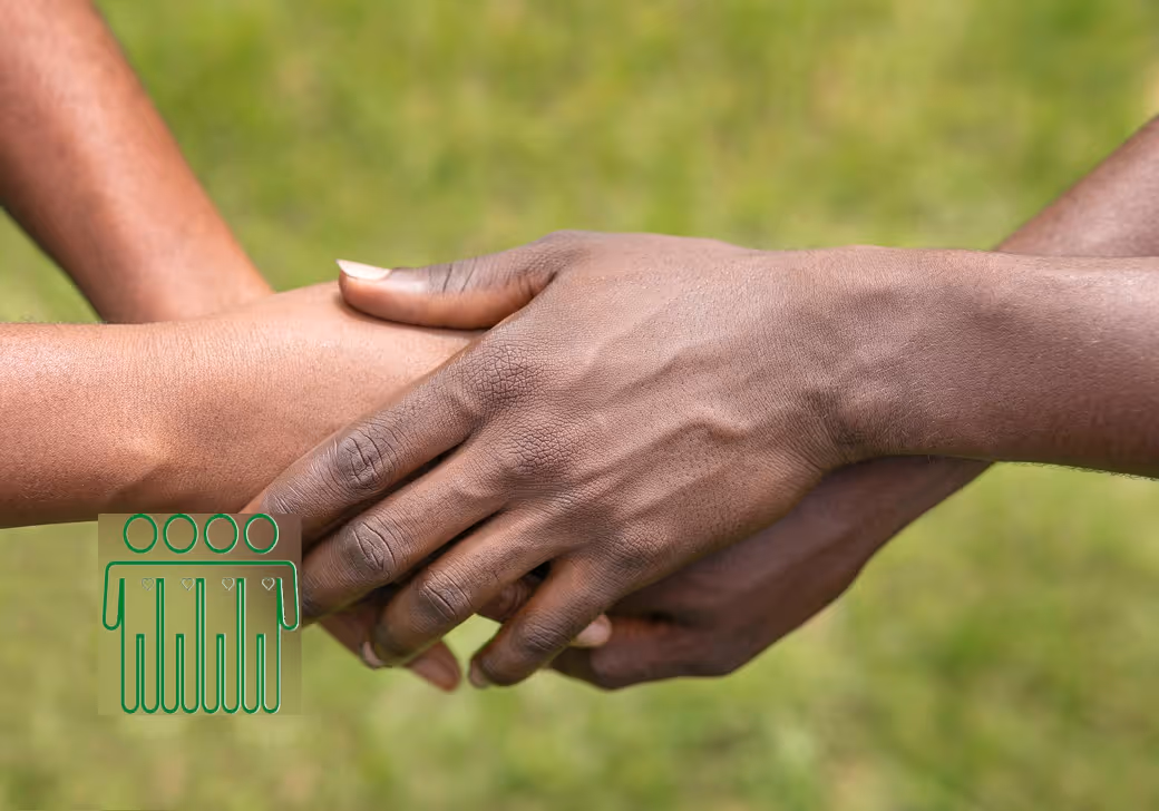 A close-up shot of three hands of different skin tones clasped together in a supportive gesture, set against a soft-focus green grass background. A green graphic icon is overlaid on the left.