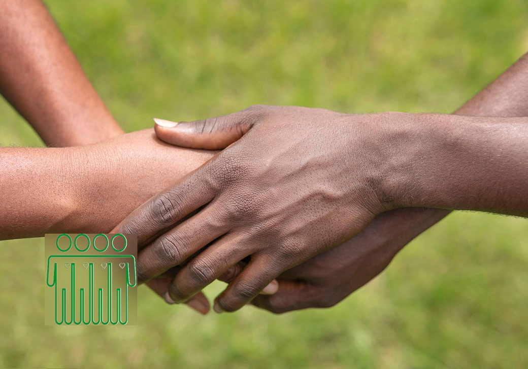 A close-up shot of three hands of different skin tones clasped together in a supportive gesture, set against a soft-focus green grass background. A green graphic icon is overlaid on the left.