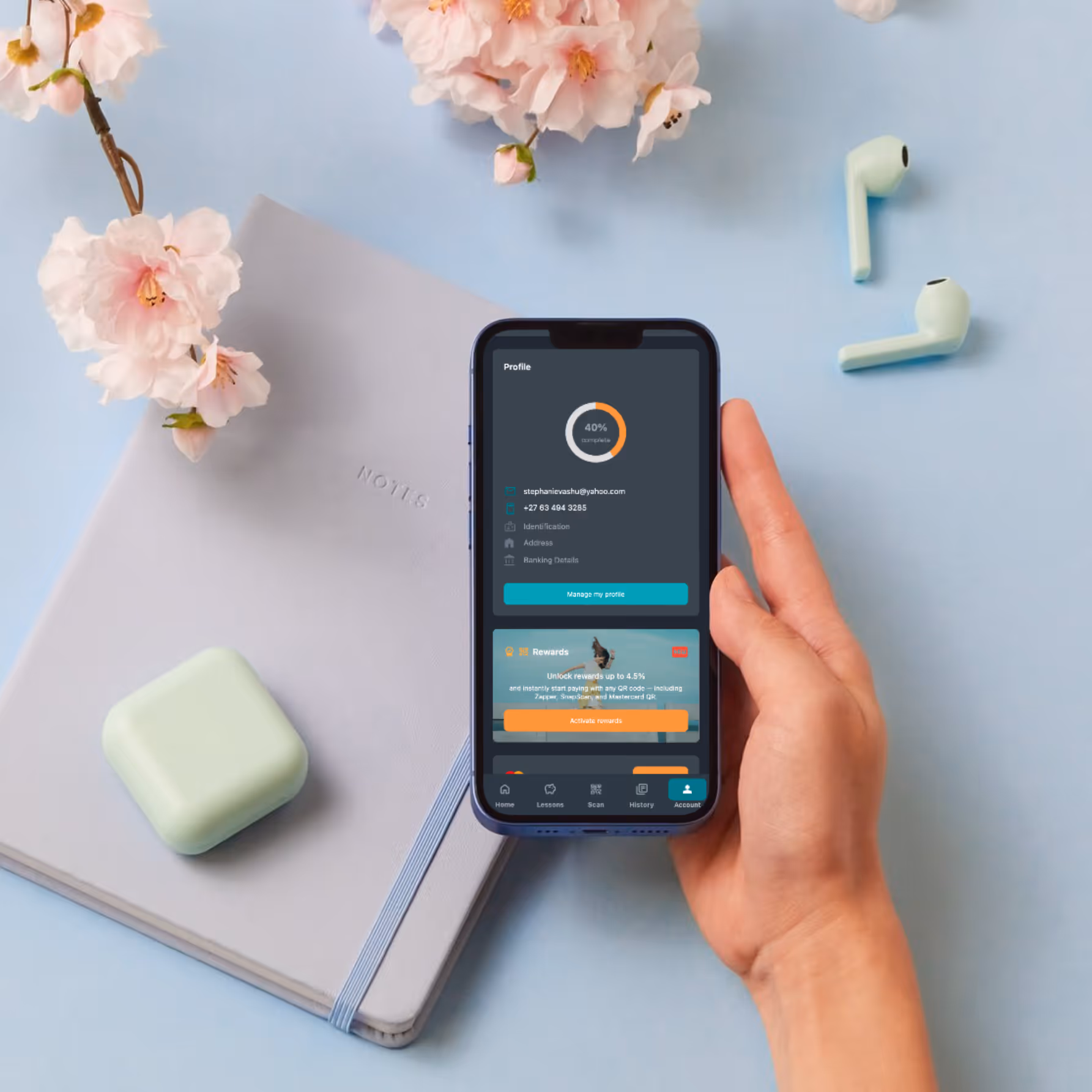 Sticitt app rewards interface shown on a smartphone. The screen highlights how parents can unlock rewards of up to 4.5% by paying via Zapper, SnapScan, and Mastercard QR. The lifestyle setting emphasizes a modern, organised parenting experience.