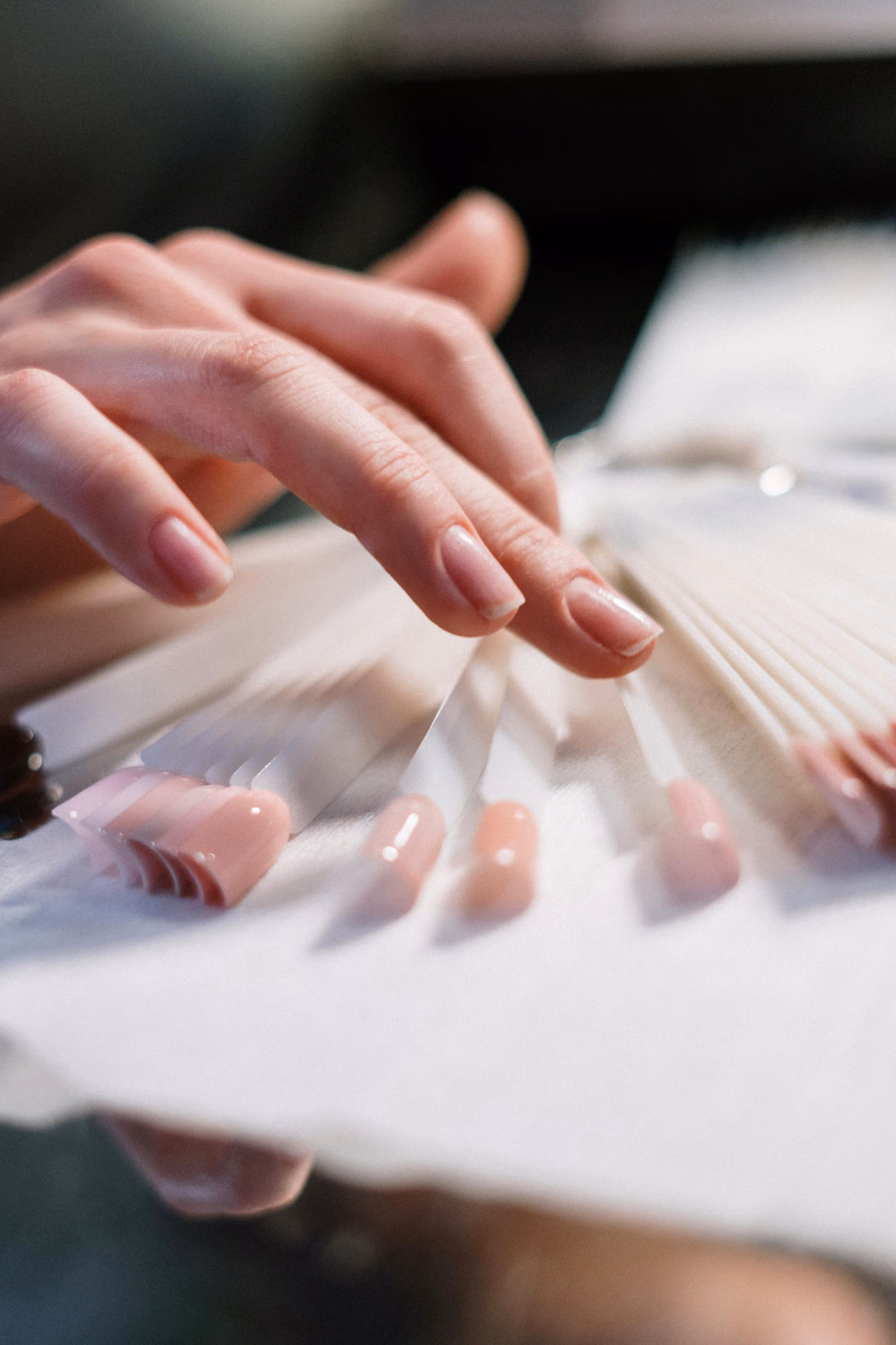 Woman selecting nail polish samples