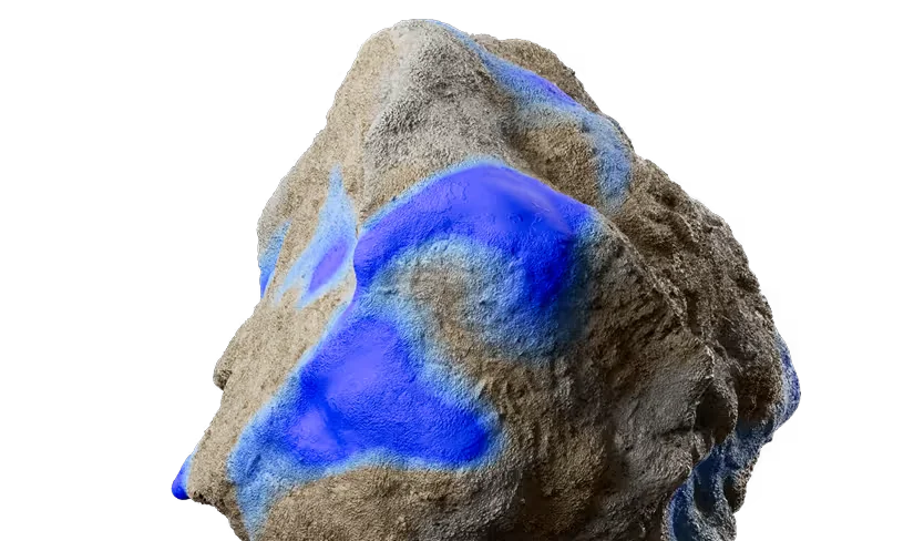 A rock with blue paint on it.