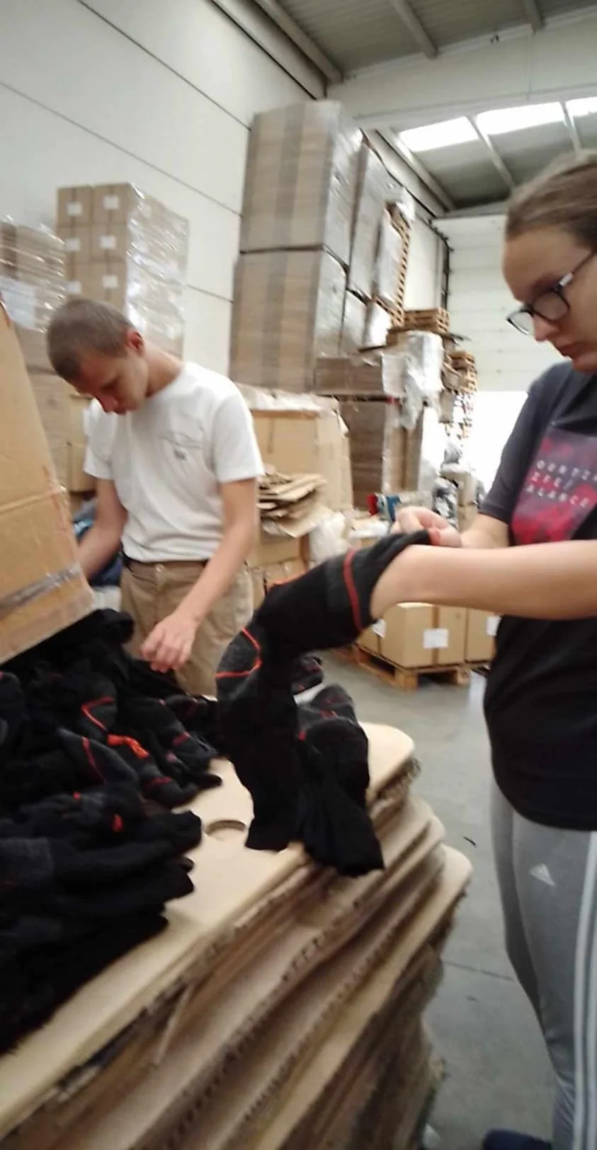 two children are putting together a package