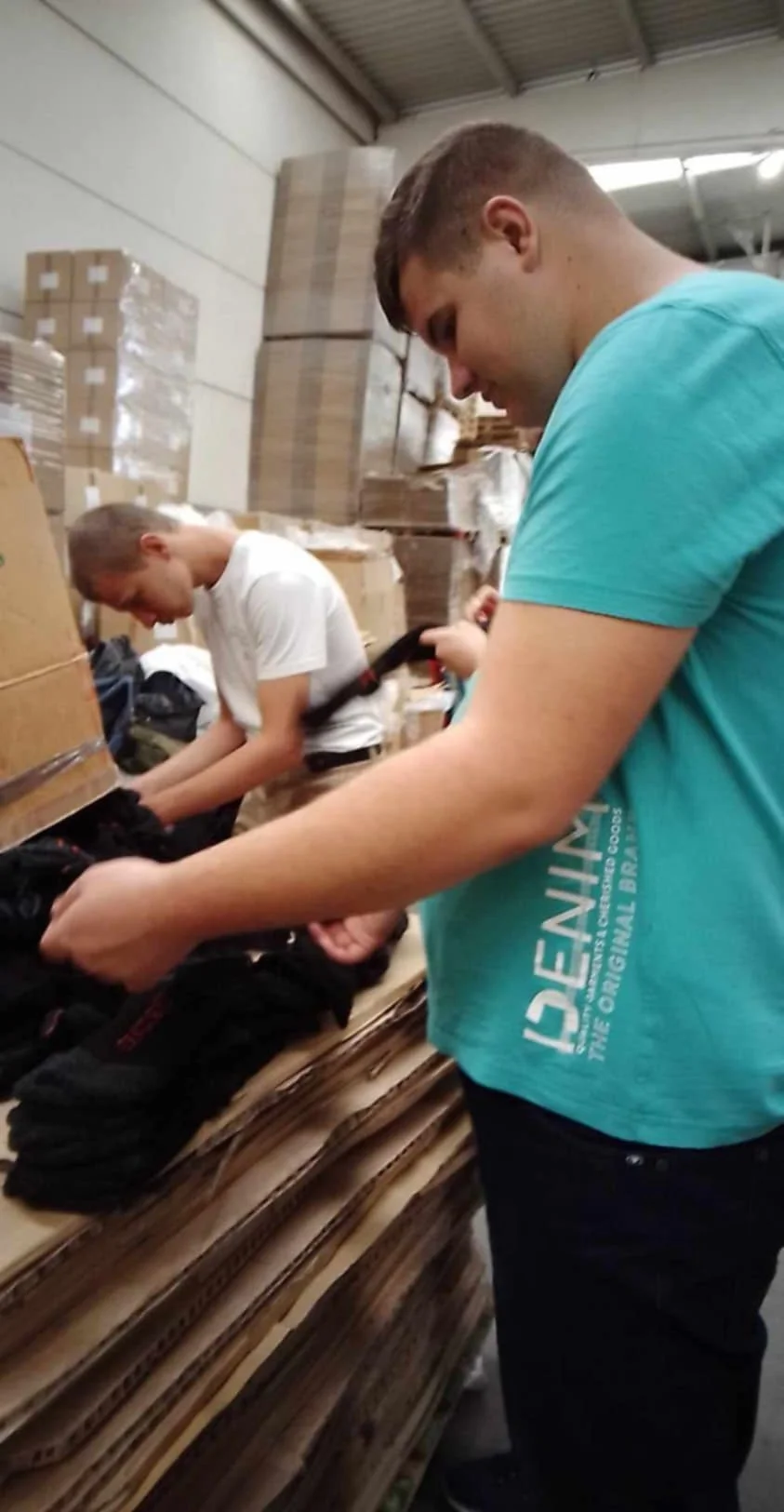 two children are putting together a package