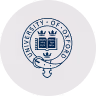 University of Toronto circular emblem with an open book and a tree above it.