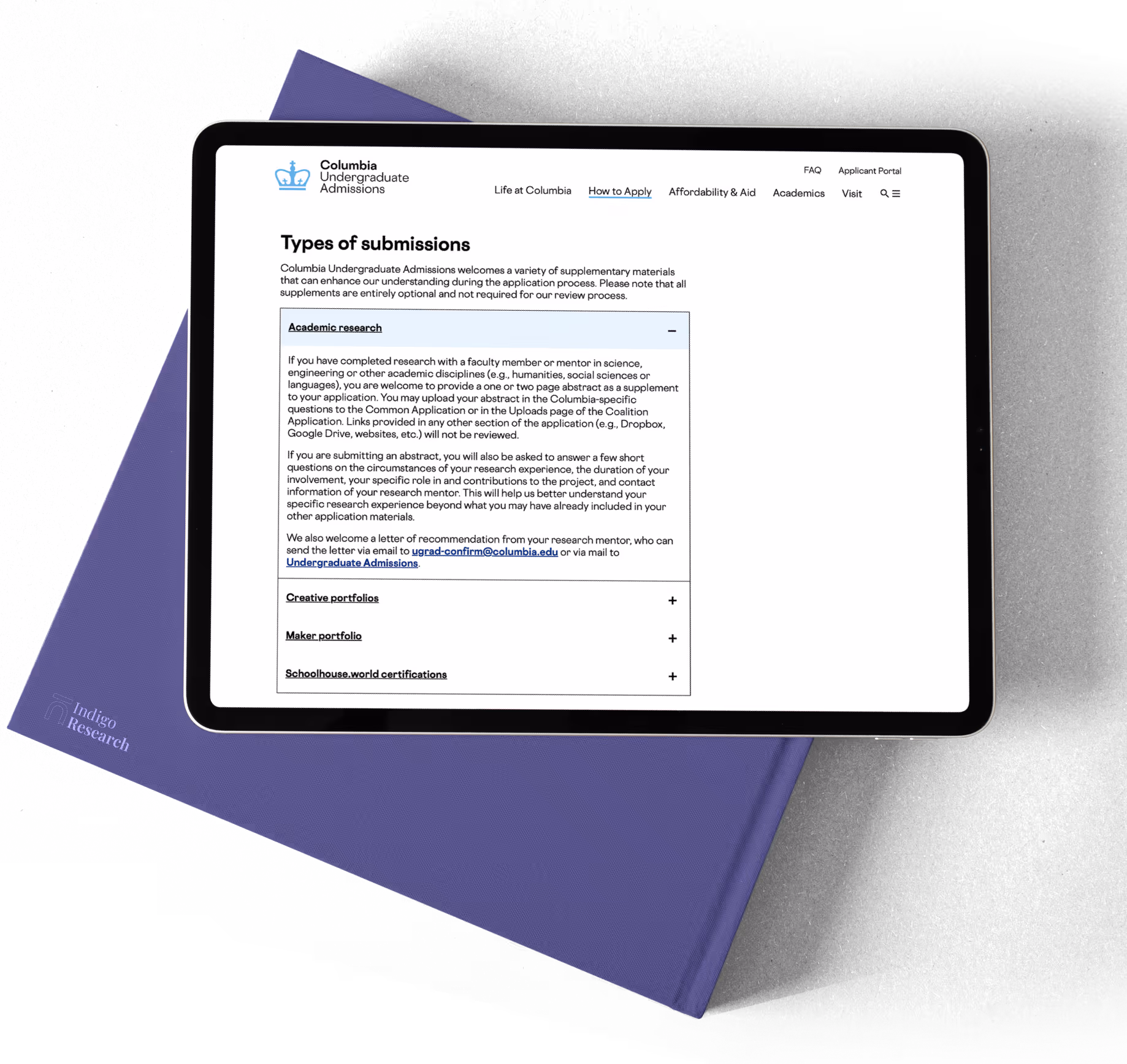 Tablet displaying Columbia Undergraduate Admissions webpage detailing types of submissions including academic research, creative portfolios, maker portfolio, and Schoolhouse.world certifications.