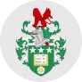 Leeds United football club crest featuring a red white rose crest, green and gold shield, and white stars.
