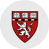 Harvard University shield with a three-part crest featuring a lion and the word VERITAS on three open books.