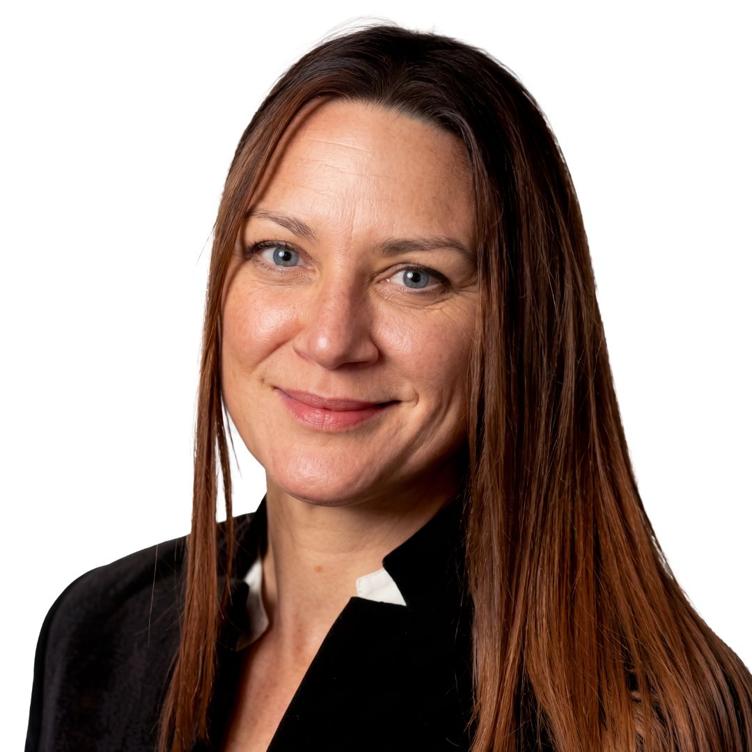 Young man in a tuxedo with a bow tie against a white background.
