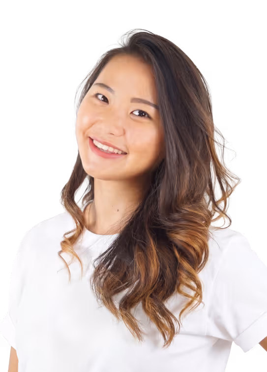 Smiling woman with long wavy hair wearing a white t-shirt on a transparent background.