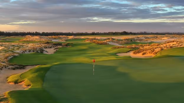 A scenic shot of The Hoiana Shores & Clubs, highlighting its expansive golf course and luxurious clubhouse