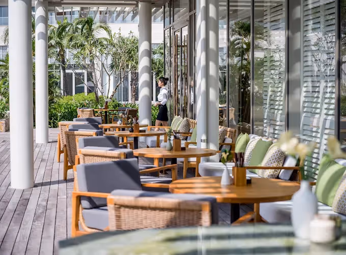 Traditional Vietnamese breakfast spread in Hoi An, featuring a variety of fresh ingredients like pho, banh mi, tropical fruits, and herbal teas, served in a charming local restaurant.