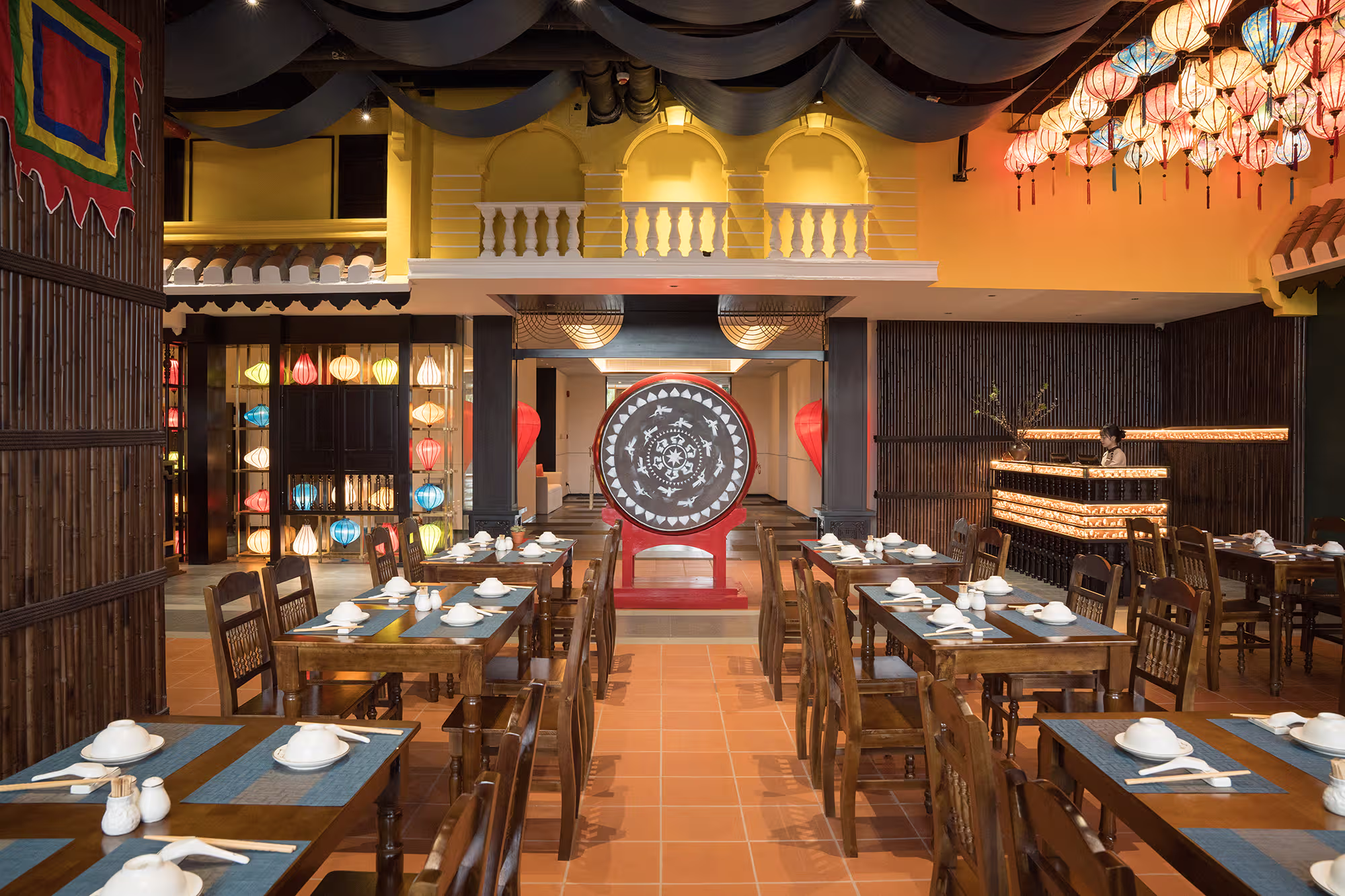 Hoi An Wonder Vietnamese restaurant at Hoiana Residences, with colourful lanterns, a traditional red drum and warm timber dining space