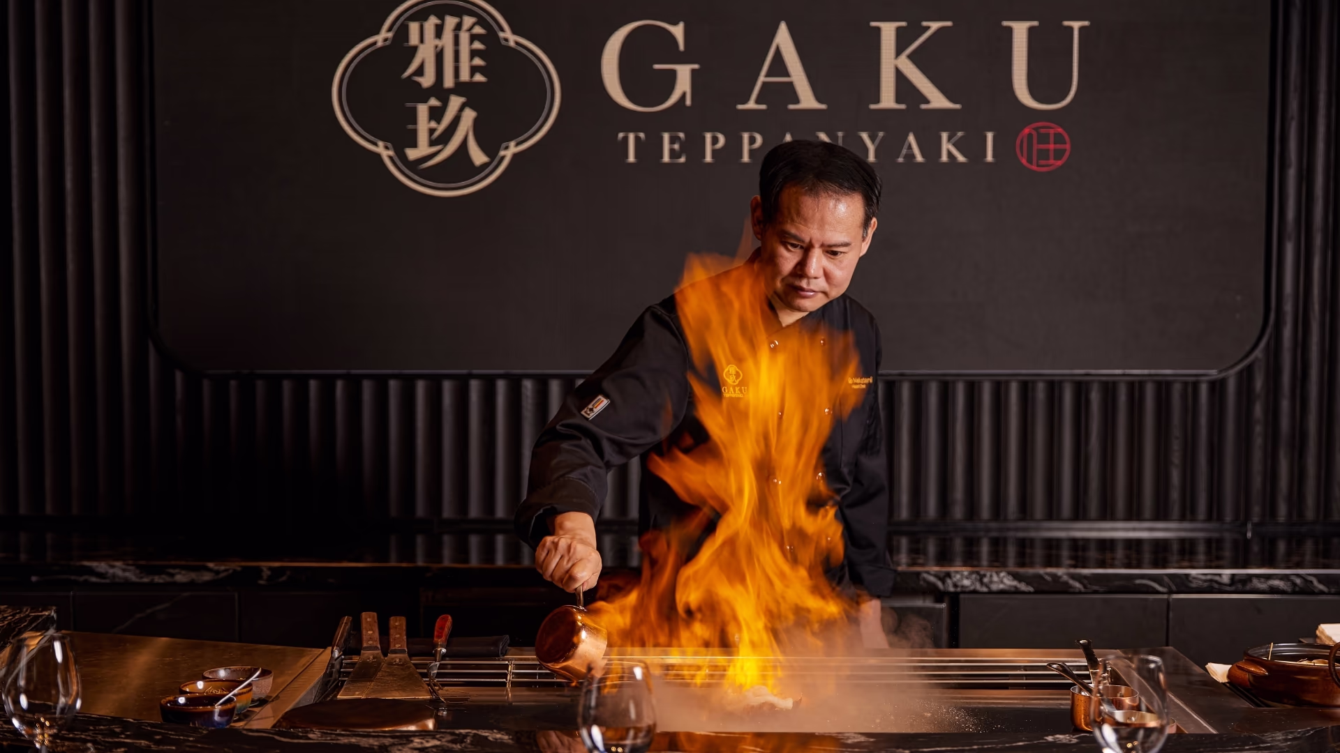A teppanyaki chef performs a dramatic flame show at Gaku Teppanyaki, New World Hoiana Beach Resort