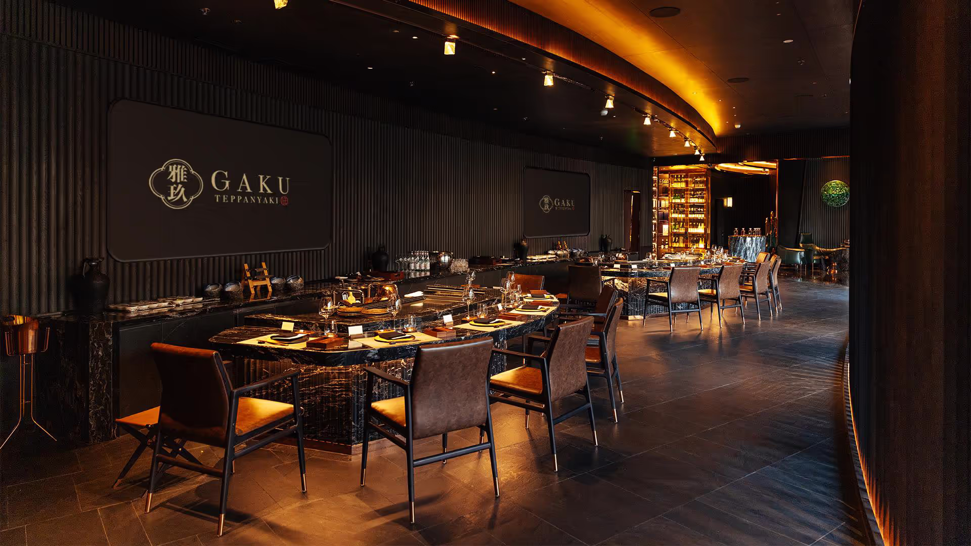 Warmly lit teppanyaki counter set for an intimate Japanese dining experience
