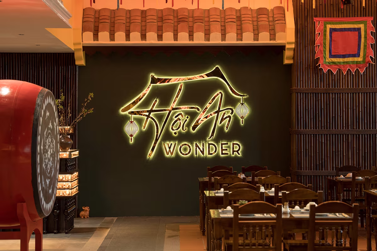 Hoi An Wonder restaurant at Hoiana featuring traditional Vietnamese decor with colorful lanterns, heritage roof tiles, and authentic local food ambiance.