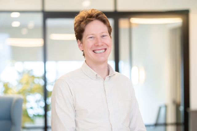 [headshot] image of satisfied student using a laptop