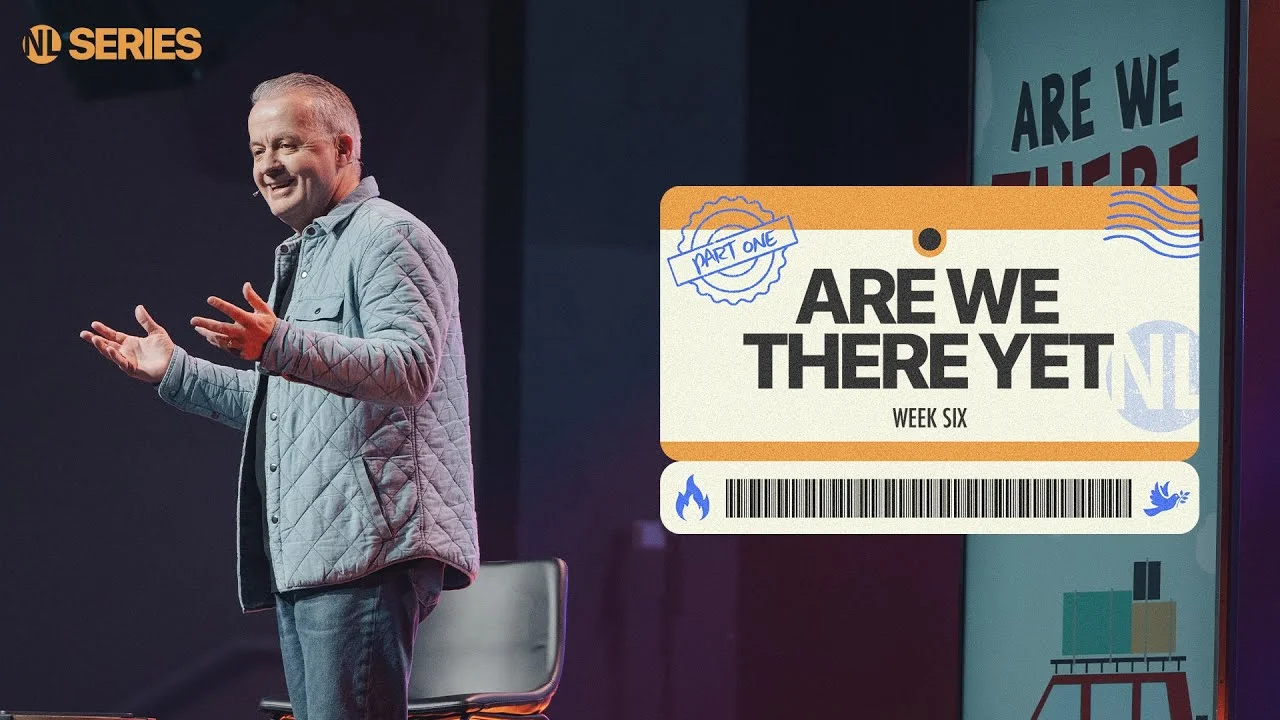Smiling pastor speaking beside a sermon graphic that says "Are We There Yet, Week Six, Part One" in the NL Series.
