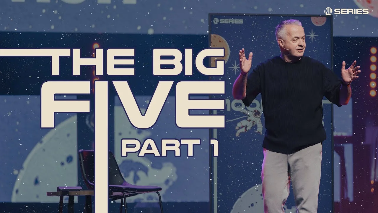 Pastor speaking on stage beside large cosmic-themed text reading "The Big Five, Part 1" from NL Series.