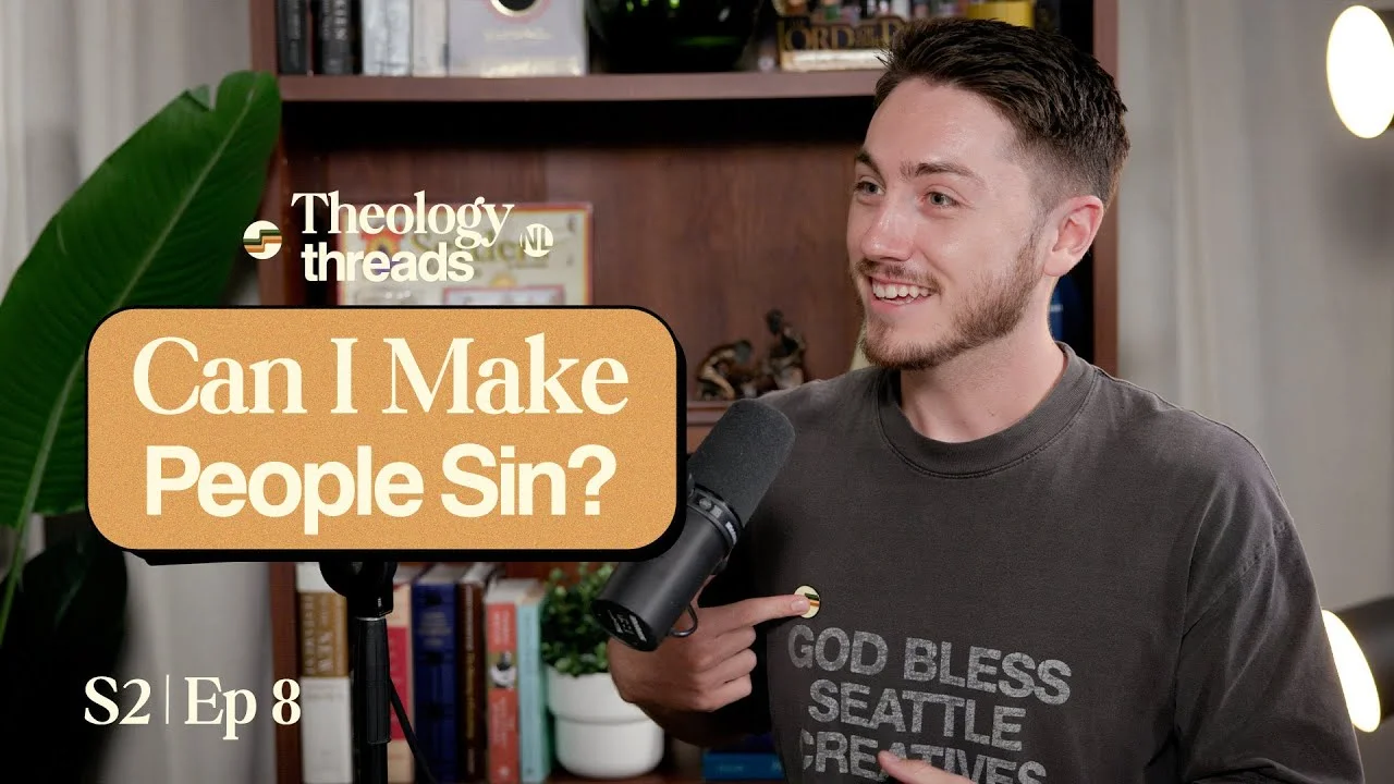 Theology Threads podcast host discussing sin with microphone.