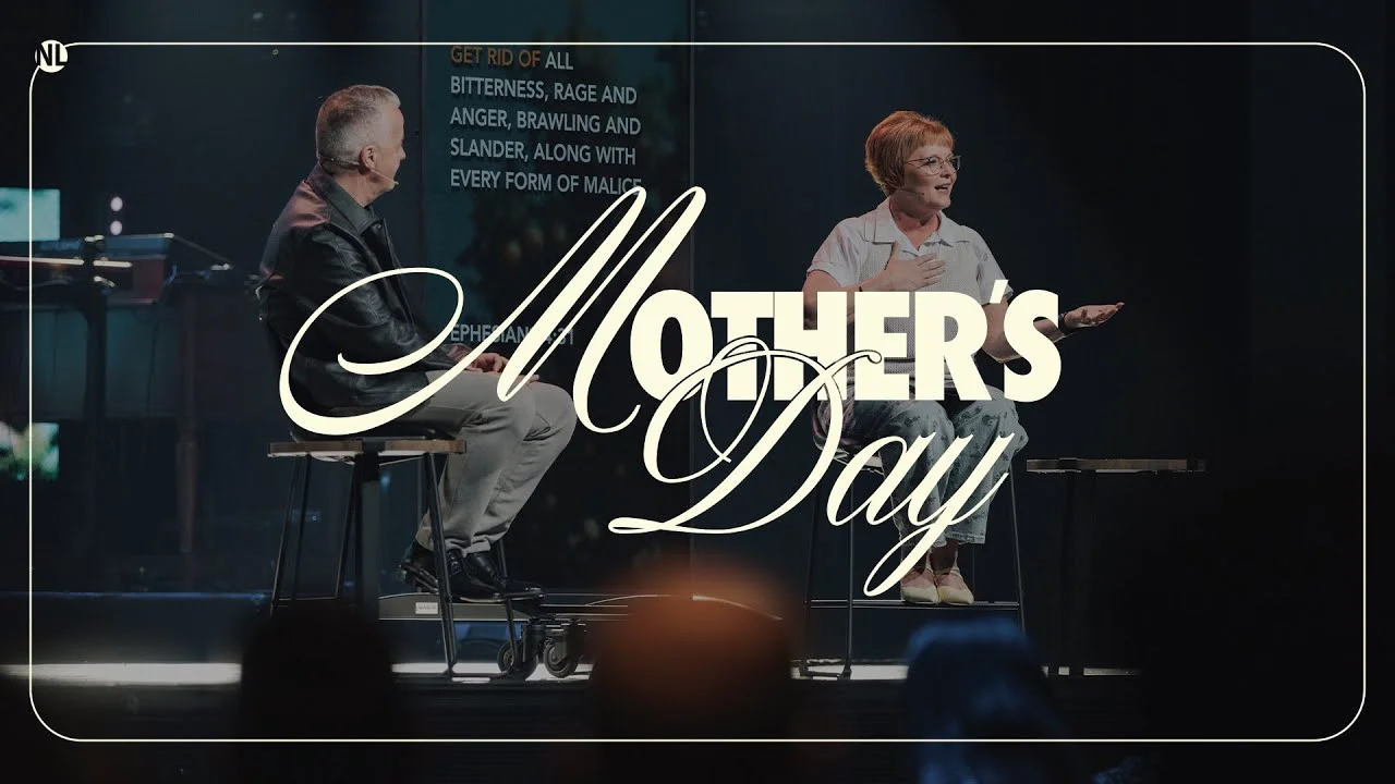 Mother’s Day church service with two speakers on stage sharing a message.
