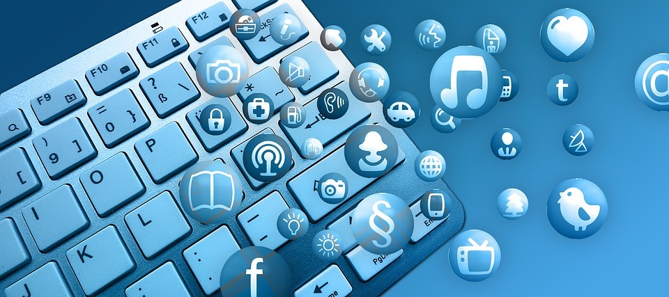 Various buttons and logos with a laptop from which mrp systems are used