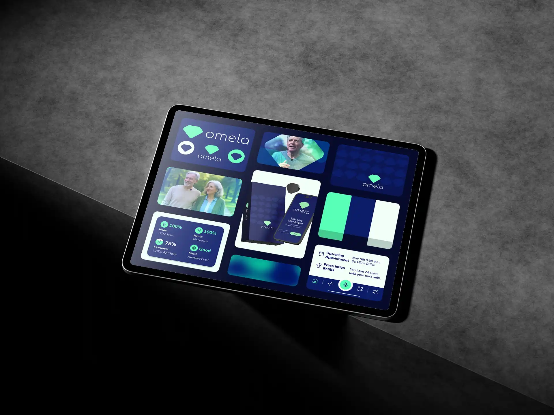 Ipad on table with Omela branding on it.