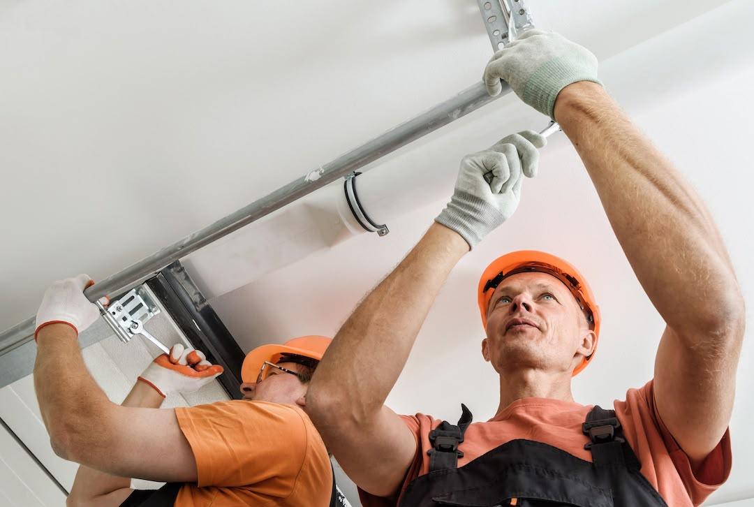 A technician working on a newly installed garage door.
