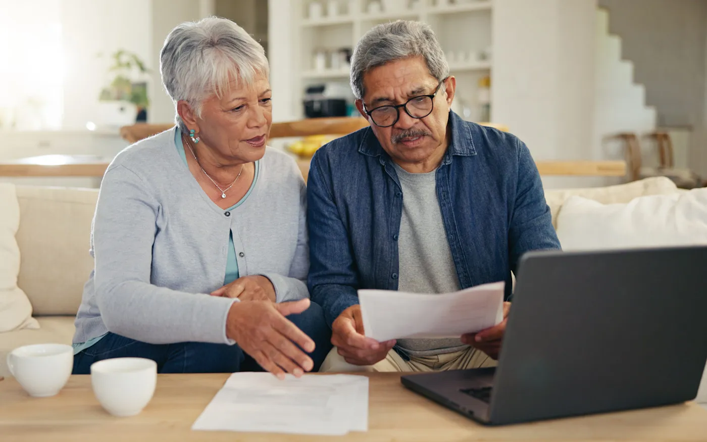 older couple reviewing options, including home equity alternatives to a cash-out refinance.