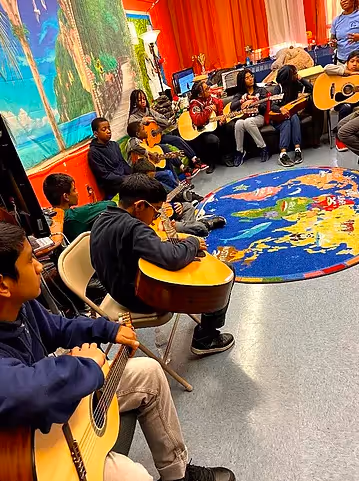 Students sitting in a circle during a classroom activity.