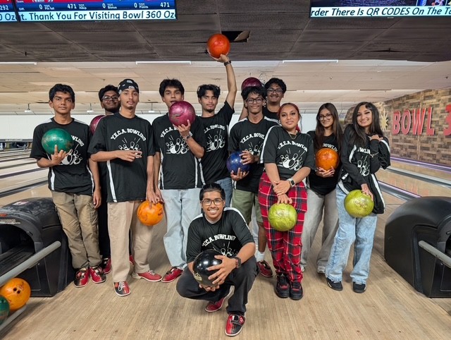 YECA bowling team students holding bowling balls at the lanes