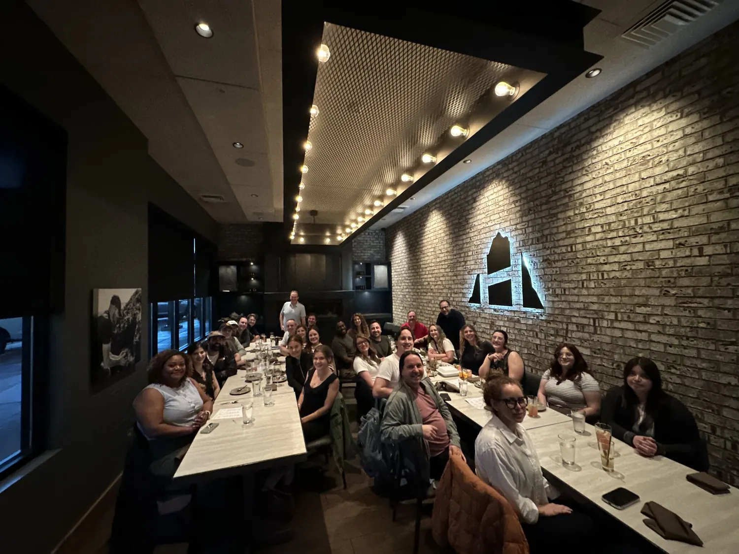 The team at a long table during a team dinner