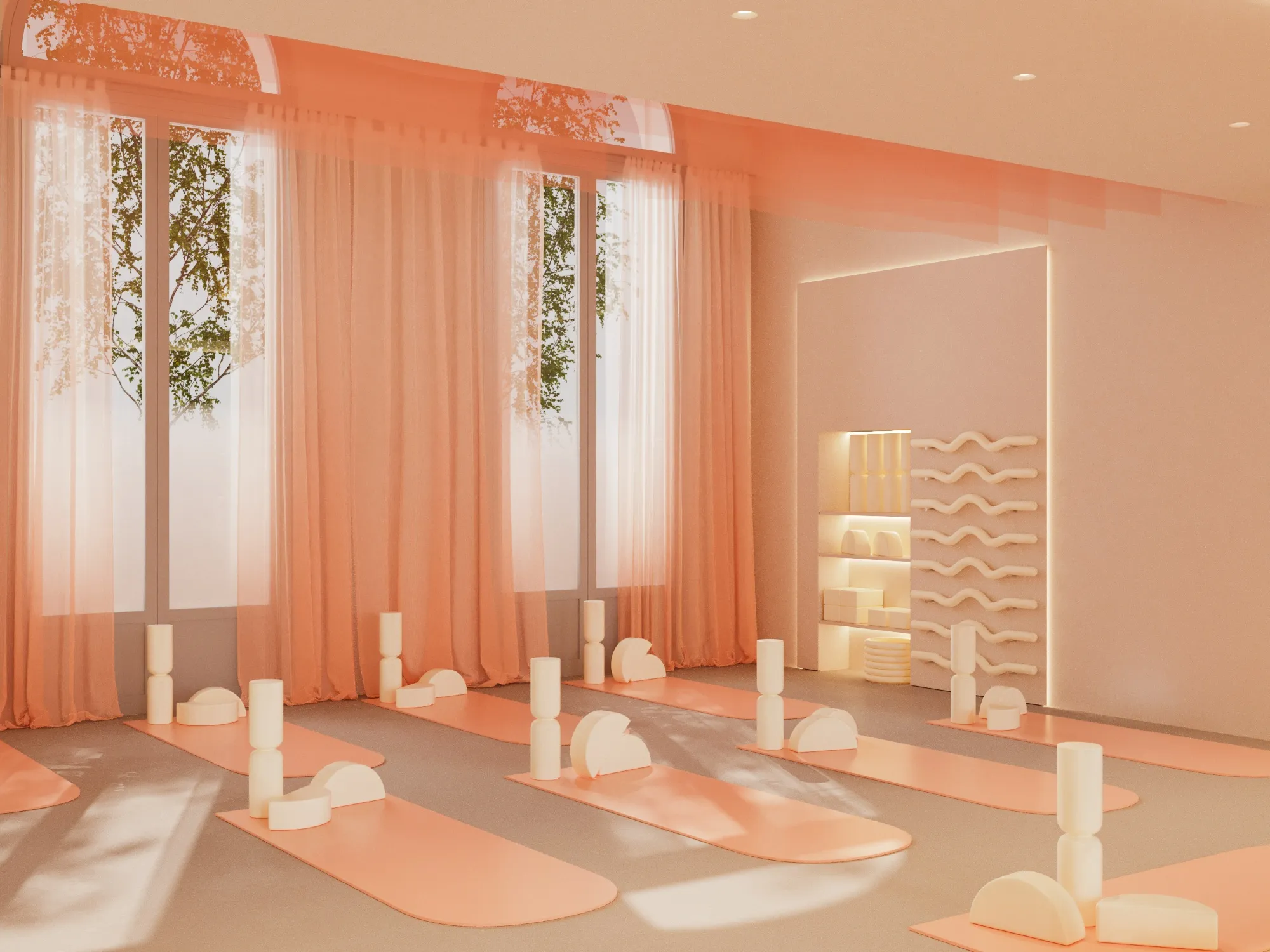 Bright yoga studio with peach-colored mats and cream-colored yoga props arranged on the floor, sheer peach curtains on large windows, and wall shelves holding additional props.