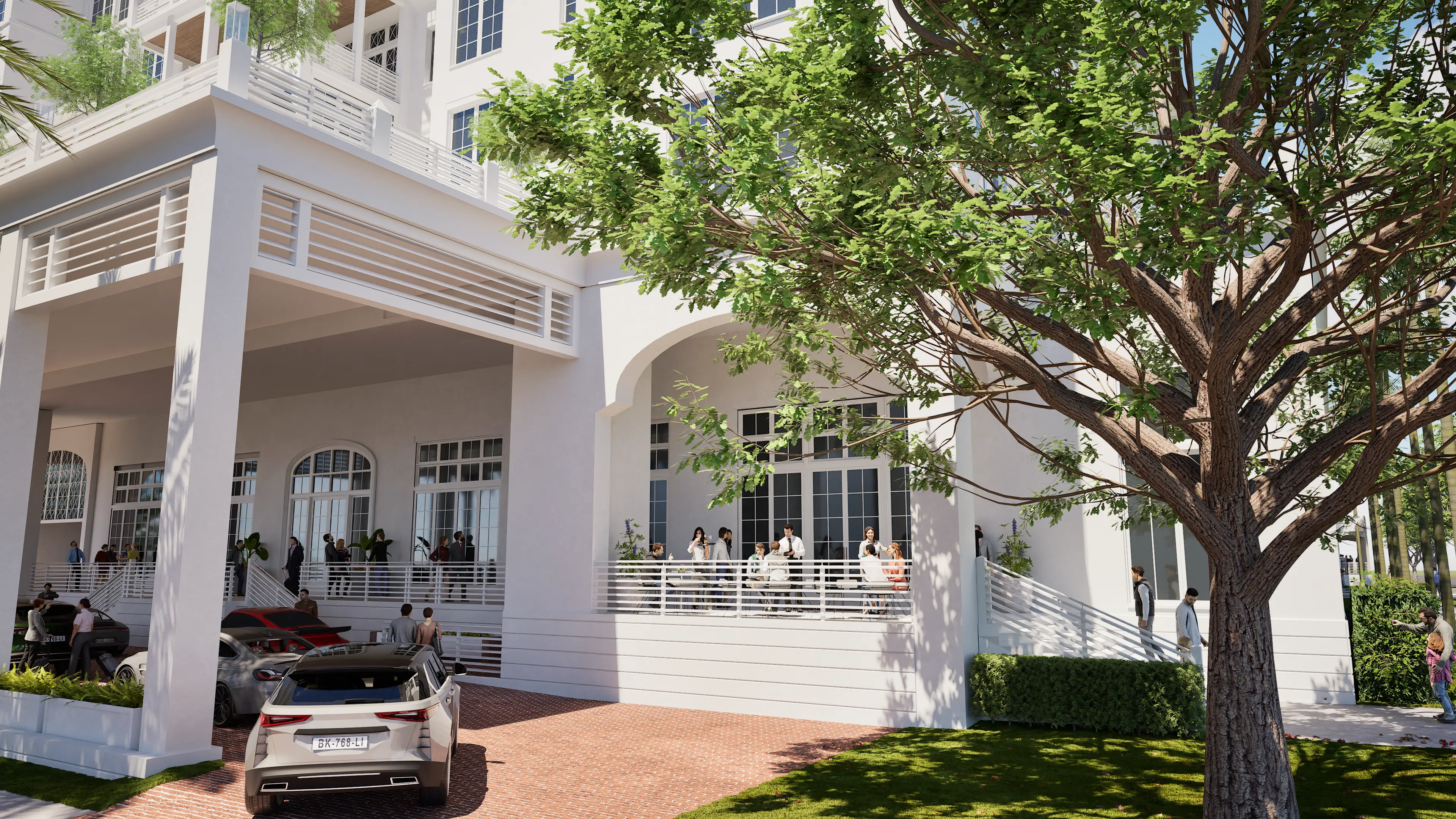 Entrance of Magnolia Hotel with covered entrance and brick color drive up.