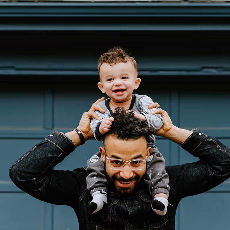A father with his child on his shoulders