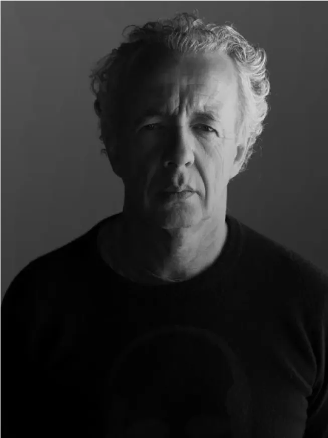 Head-and-shoulders of an older man in a black shirt