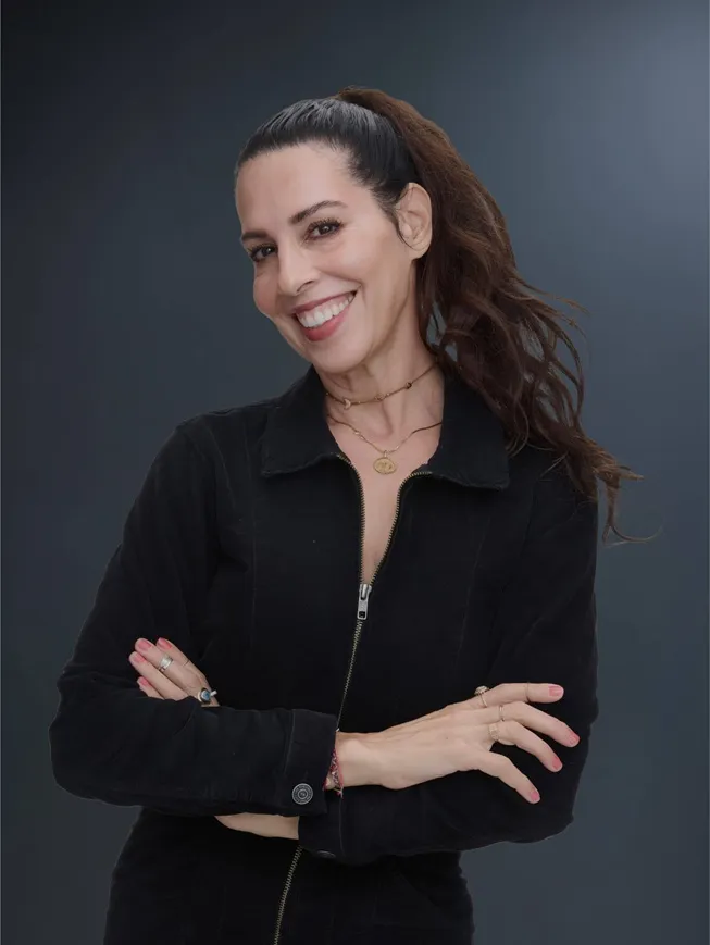 Portrait of smiling brunette woman wearing a black blazer