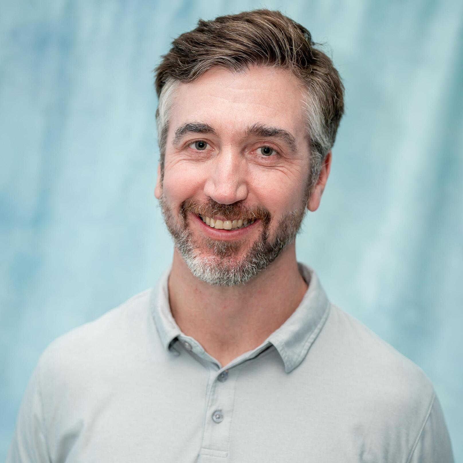Professional headshot of William Habart, staff member
