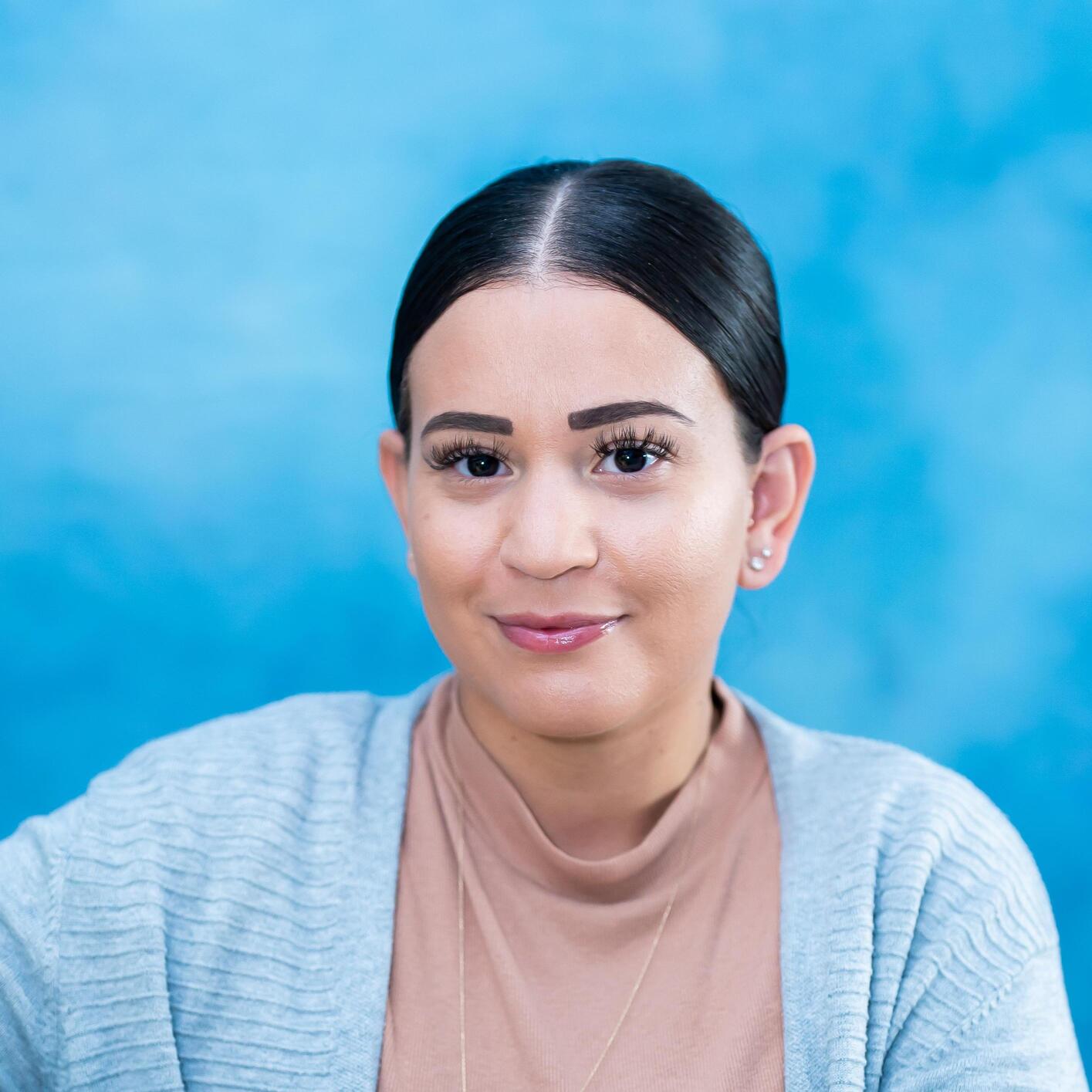 Staff member headshot on blue background