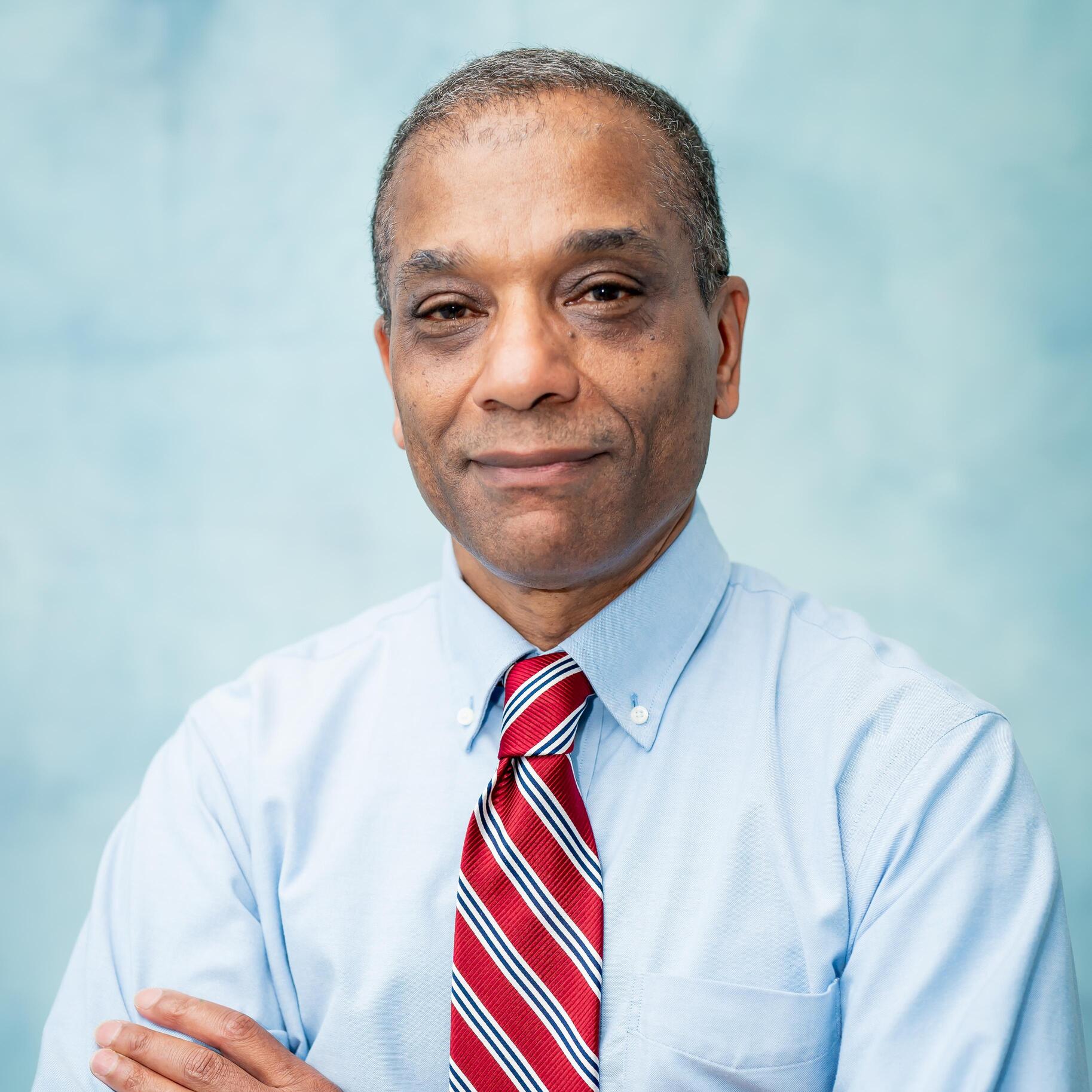 Professional headshot of staff member Anthony Hudson