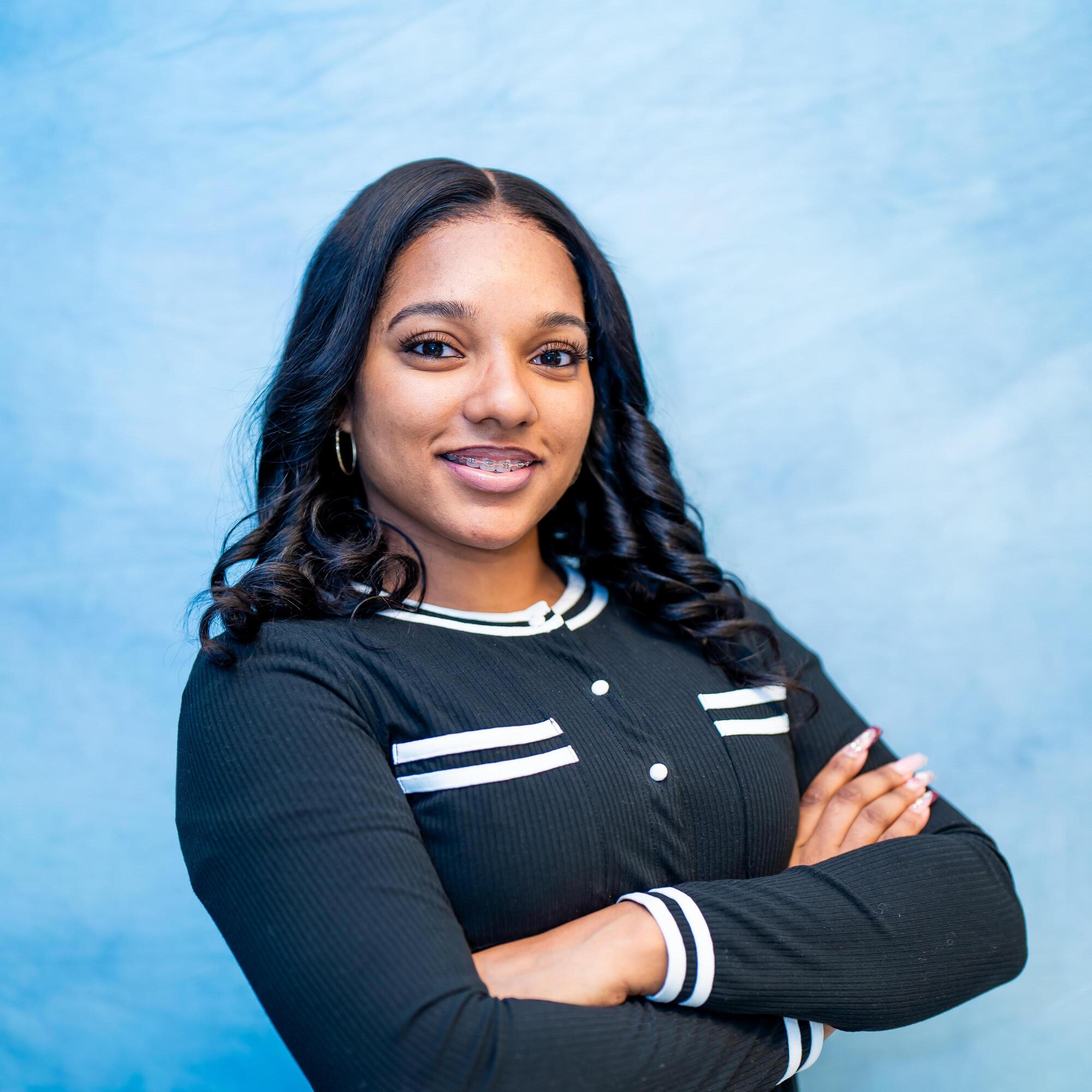 Student portrait of Olivia Inniss smiling with braces