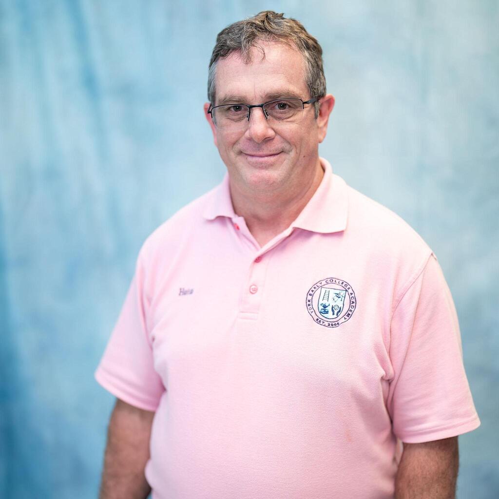 Staff member portrait in pink school polo