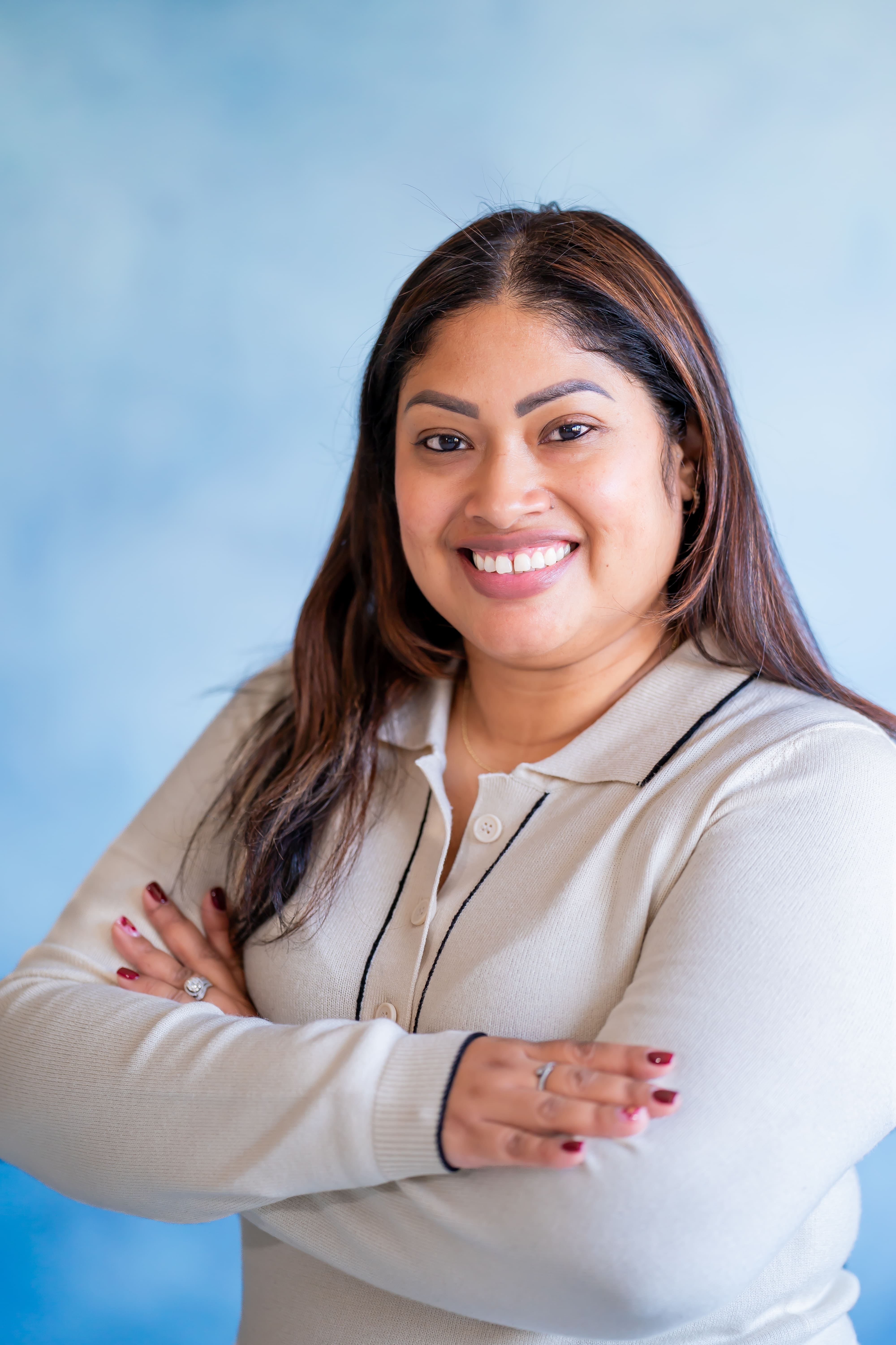 Denisse Garcia professional headshot with arms crossed