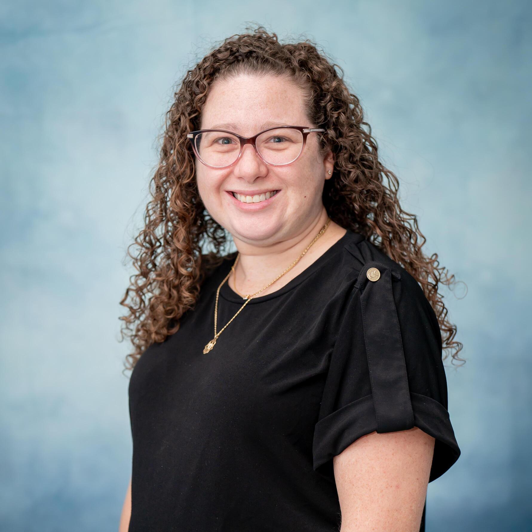 Staff member smiling in professional portrait