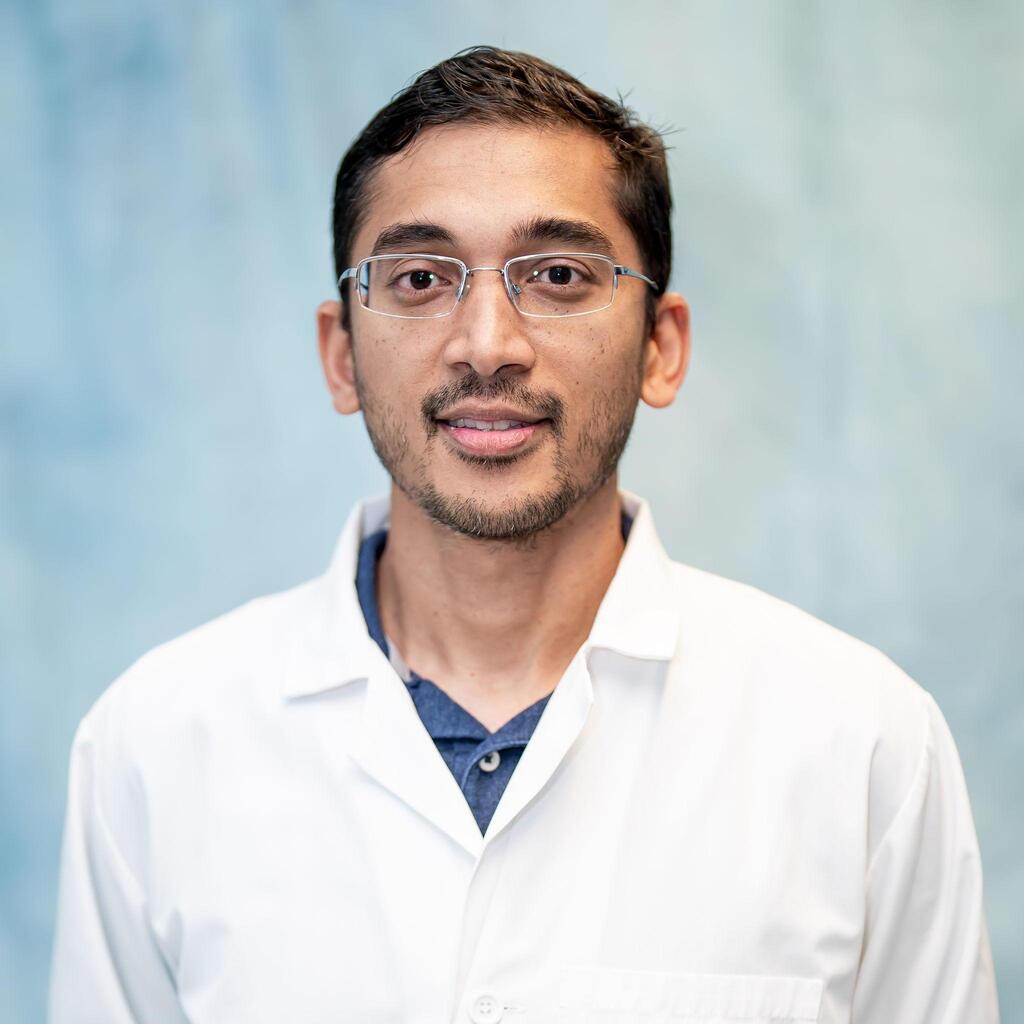 Pravesh Shiwnarain staff portrait in white lab coat