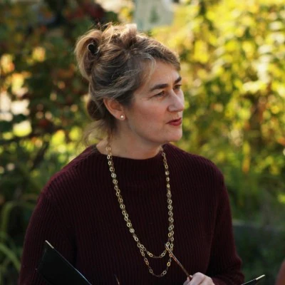 WashTech client Lisa Hartley smiling in outdoor setting.