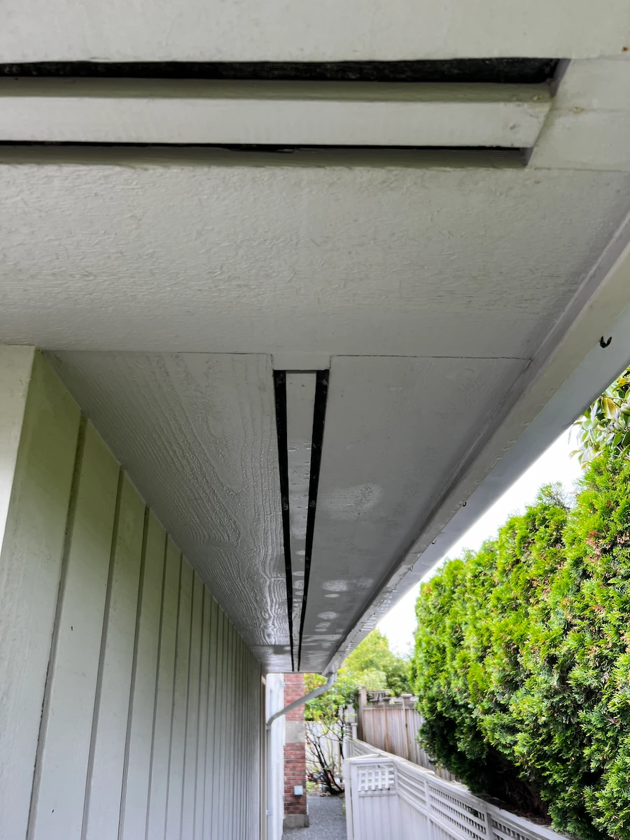 Exterior soffit and siding after professional soft washing, with dirt and mildew removed and surfaces restored to a clean, bright finish in Vancouver.