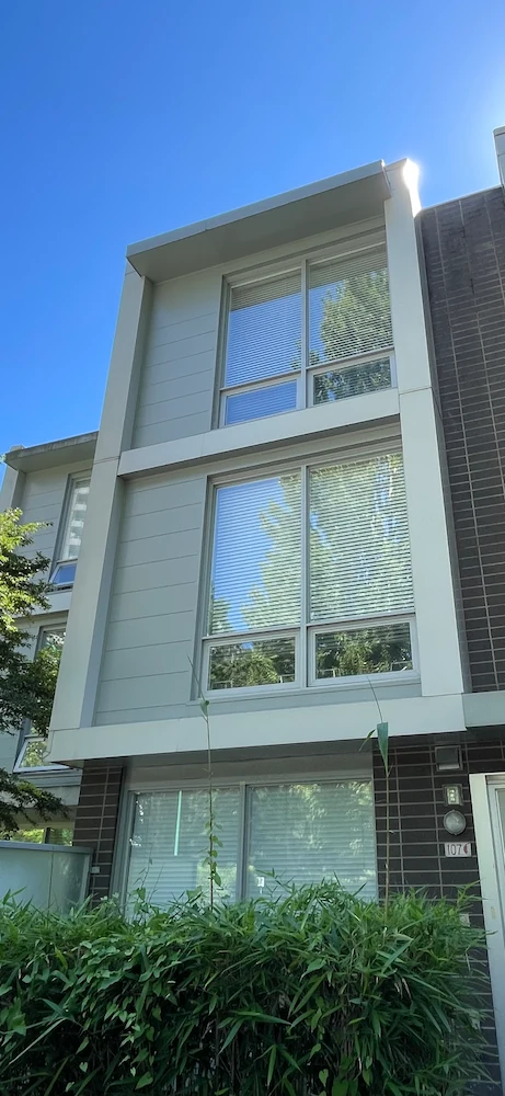 Residential townhouse with clean gutters after professional gutter cleaning service.