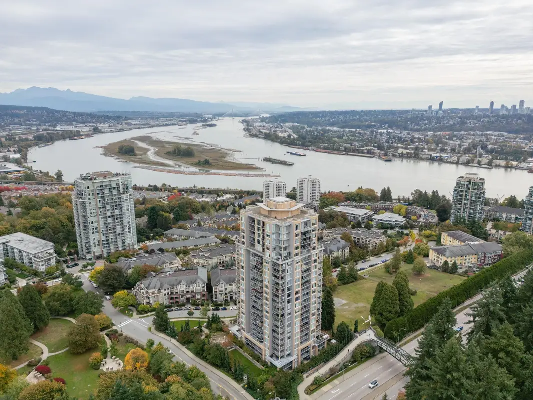 Aerial view of high-rises and Fraser River from Glenbrooke, New Westminster; professional exterior and roof cleaning.