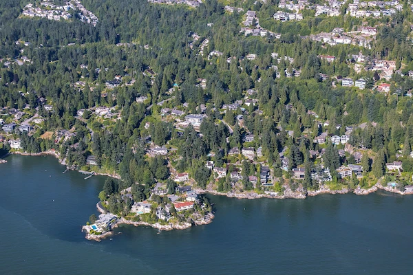 Green coastal homes in Caulfeild, West Vancouver surrounded by trees; expert exterior and soft wash cleaning.